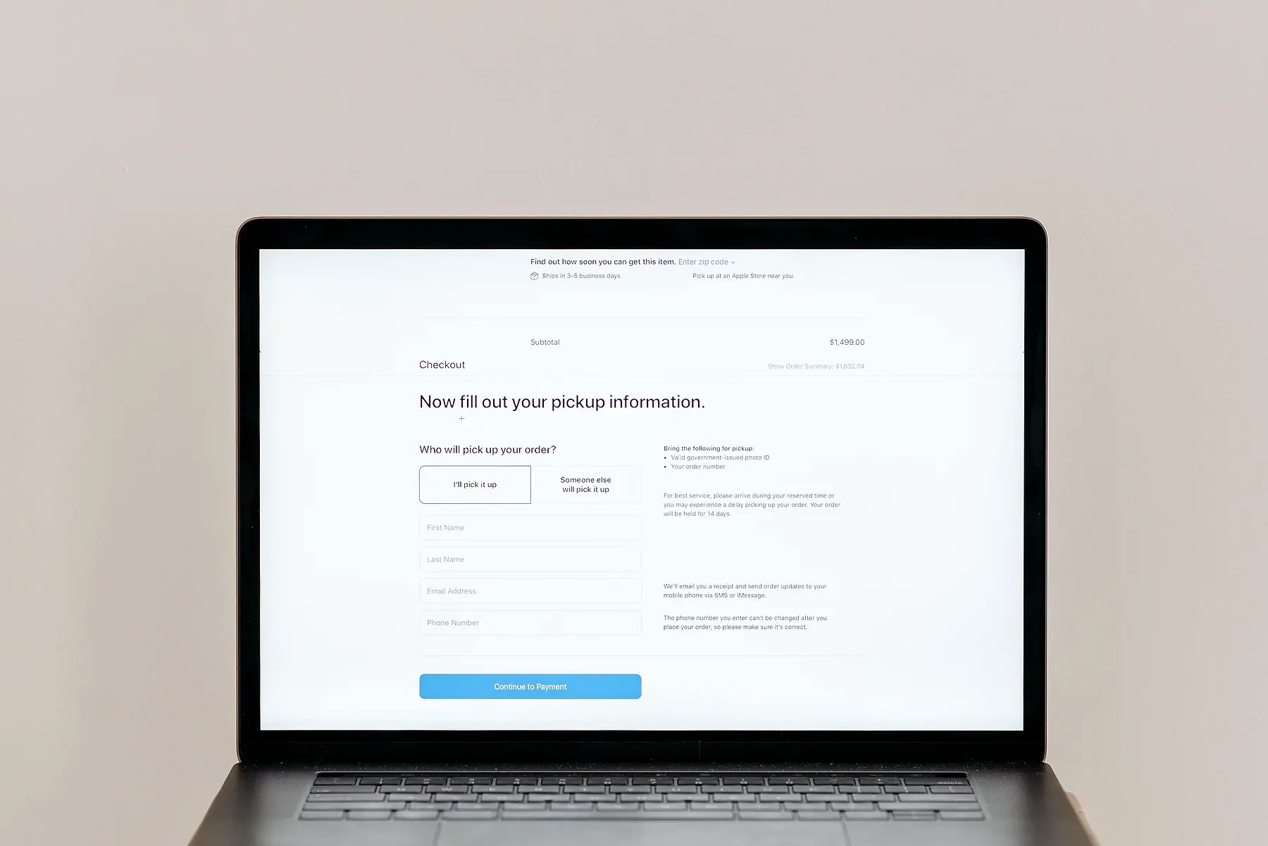A laptop showing a simple web form asking the visitor to fill in their details